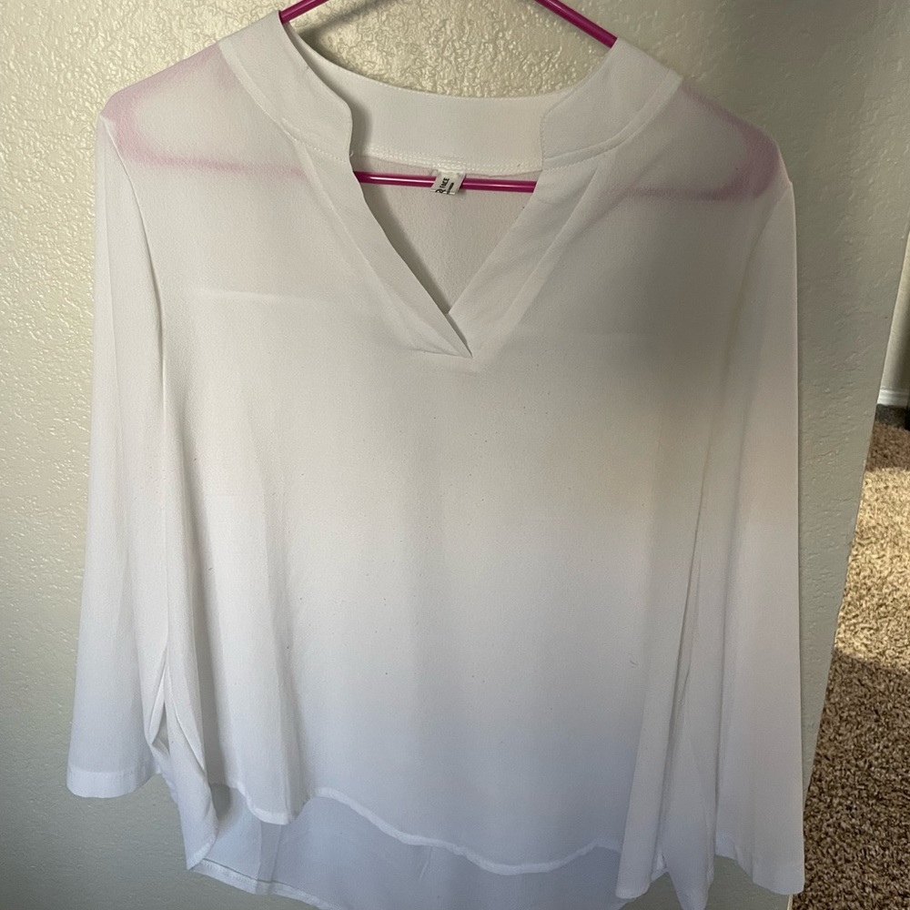 Small, white, long sleeved blouse